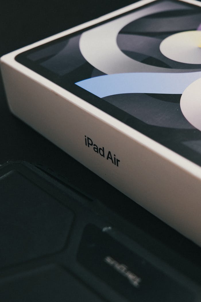 Focused view of iPad Air box displaying brand packaging on a dark background.
